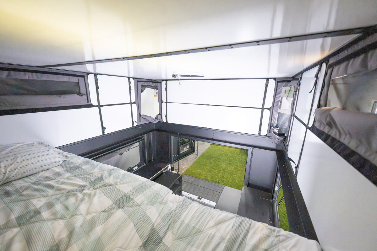 View from the bed of an Oru Bruin XL looking out past the end of the platform to the open rear doors